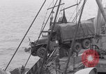 Image of truck lifted to landing craft WW2 France, 1944, second 46 stock footage video 65675079352