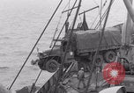 Image of truck lifted to landing craft WW2 France, 1944, second 47 stock footage video 65675079352