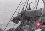Image of truck lifted to landing craft WW2 France, 1944, second 48 stock footage video 65675079352
