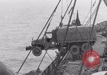 Image of truck lifted to landing craft WW2 France, 1944, second 51 stock footage video 65675079352