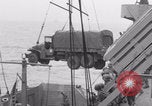 Image of truck lifted to landing craft WW2 France, 1944, second 52 stock footage video 65675079352