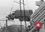 Image of truck lifted to landing craft WW2 France, 1944, second 53 stock footage video 65675079352