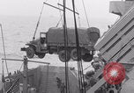 Image of truck lifted to landing craft WW2 France, 1944, second 54 stock footage video 65675079352