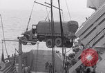Image of truck lifted to landing craft WW2 France, 1944, second 55 stock footage video 65675079352