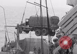Image of truck lifted to landing craft WW2 France, 1944, second 56 stock footage video 65675079352