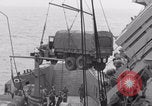 Image of truck lifted to landing craft WW2 France, 1944, second 58 stock footage video 65675079352