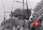 Image of truck lifted to landing craft WW2 France, 1944, second 60 stock footage video 65675079352
