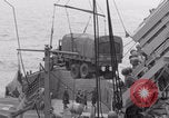 Image of truck lifted to landing craft WW2 France, 1944, second 61 stock footage video 65675079352