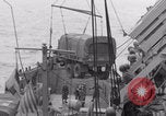 Image of truck lifted to landing craft WW2 France, 1944, second 62 stock footage video 65675079352