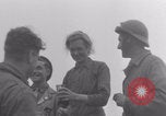 Image of Free French soldiers with civilians Normandy Foucarville France, 1944, second 52 stock footage video 65675079361