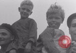 Image of Free French soldiers with Normandy children Foucarville France, 1944, second 18 stock footage video 65675079362