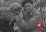 Image of Free French soldiers with Normandy children Foucarville France, 1944, second 57 stock footage video 65675079362