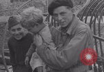 Image of Free French soldiers with Normandy children Foucarville France, 1944, second 58 stock footage video 65675079362