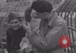 Image of Free French soldiers with Normandy children Foucarville France, 1944, second 60 stock footage video 65675079362