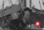 Image of M3 half-track hoisted to LST Southampton England, 1944, second 23 stock footage video 65675079387