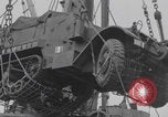 Image of M3 half-track hoisted to LST Southampton England, 1944, second 27 stock footage video 65675079387