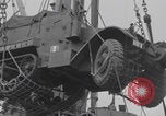 Image of M3 half-track hoisted to LST Southampton England, 1944, second 28 stock footage video 65675079387