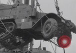 Image of M3 half-track hoisted to LST Southampton England, 1944, second 31 stock footage video 65675079387