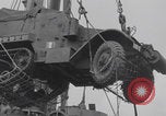 Image of M3 half-track hoisted to LST Southampton England, 1944, second 32 stock footage video 65675079387