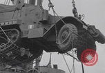 Image of M3 half-track hoisted to LST Southampton England, 1944, second 33 stock footage video 65675079387