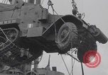 Image of M3 half-track hoisted to LST Southampton England, 1944, second 34 stock footage video 65675079387