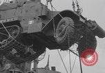 Image of M3 half-track hoisted to LST Southampton England, 1944, second 36 stock footage video 65675079387