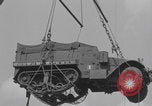 Image of M3 half-track hoisted to LST Southampton England, 1944, second 37 stock footage video 65675079387