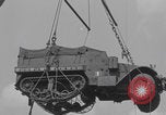 Image of M3 half-track hoisted to LST Southampton England, 1944, second 38 stock footage video 65675079387