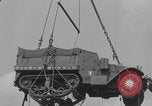 Image of M3 half-track hoisted to LST Southampton England, 1944, second 42 stock footage video 65675079387
