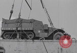 Image of M3 half-track hoisted to LST Southampton England, 1944, second 46 stock footage video 65675079387