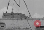 Image of M3 half-track hoisted to LST Southampton England, 1944, second 50 stock footage video 65675079387