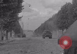 Image of M4 Sherman tank fires in street WW2 Antony France, 1944, second 3 stock footage video 65675079398