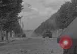 Image of M4 Sherman tank fires in street WW2 Antony France, 1944, second 4 stock footage video 65675079398