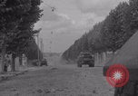 Image of M4 Sherman tank fires in street WW2 Antony France, 1944, second 5 stock footage video 65675079398