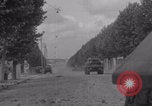 Image of M4 Sherman tank fires in street WW2 Antony France, 1944, second 6 stock footage video 65675079398