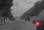 Image of M4 Sherman tank fires in street WW2 Antony France, 1944, second 7 stock footage video 65675079398