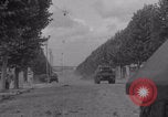 Image of M4 Sherman tank fires in street WW2 Antony France, 1944, second 8 stock footage video 65675079398