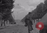 Image of M4 Sherman tank fires in street WW2 Antony France, 1944, second 11 stock footage video 65675079398