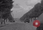 Image of M4 Sherman tank fires in street WW2 Antony France, 1944, second 13 stock footage video 65675079398