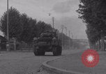 Image of M4 Sherman tank fires in street WW2 Antony France, 1944, second 21 stock footage video 65675079398