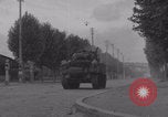Image of M4 Sherman tank fires in street WW2 Antony France, 1944, second 22 stock footage video 65675079398