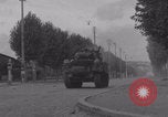 Image of M4 Sherman tank fires in street WW2 Antony France, 1944, second 23 stock footage video 65675079398