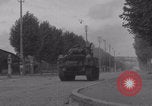 Image of M4 Sherman tank fires in street WW2 Antony France, 1944, second 24 stock footage video 65675079398