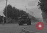 Image of M4 Sherman tank fires in street WW2 Antony France, 1944, second 25 stock footage video 65675079398
