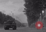 Image of M4 Sherman tank fires in street WW2 Antony France, 1944, second 26 stock footage video 65675079398