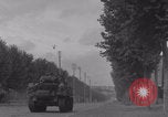 Image of M4 Sherman tank fires in street WW2 Antony France, 1944, second 28 stock footage video 65675079398