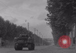 Image of M4 Sherman tank fires in street WW2 Antony France, 1944, second 29 stock footage video 65675079398