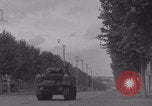 Image of M4 Sherman tank fires in street WW2 Antony France, 1944, second 31 stock footage video 65675079398