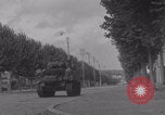 Image of M4 Sherman tank fires in street WW2 Antony France, 1944, second 33 stock footage video 65675079398