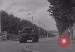 Image of M4 Sherman tank fires in street WW2 Antony France, 1944, second 34 stock footage video 65675079398